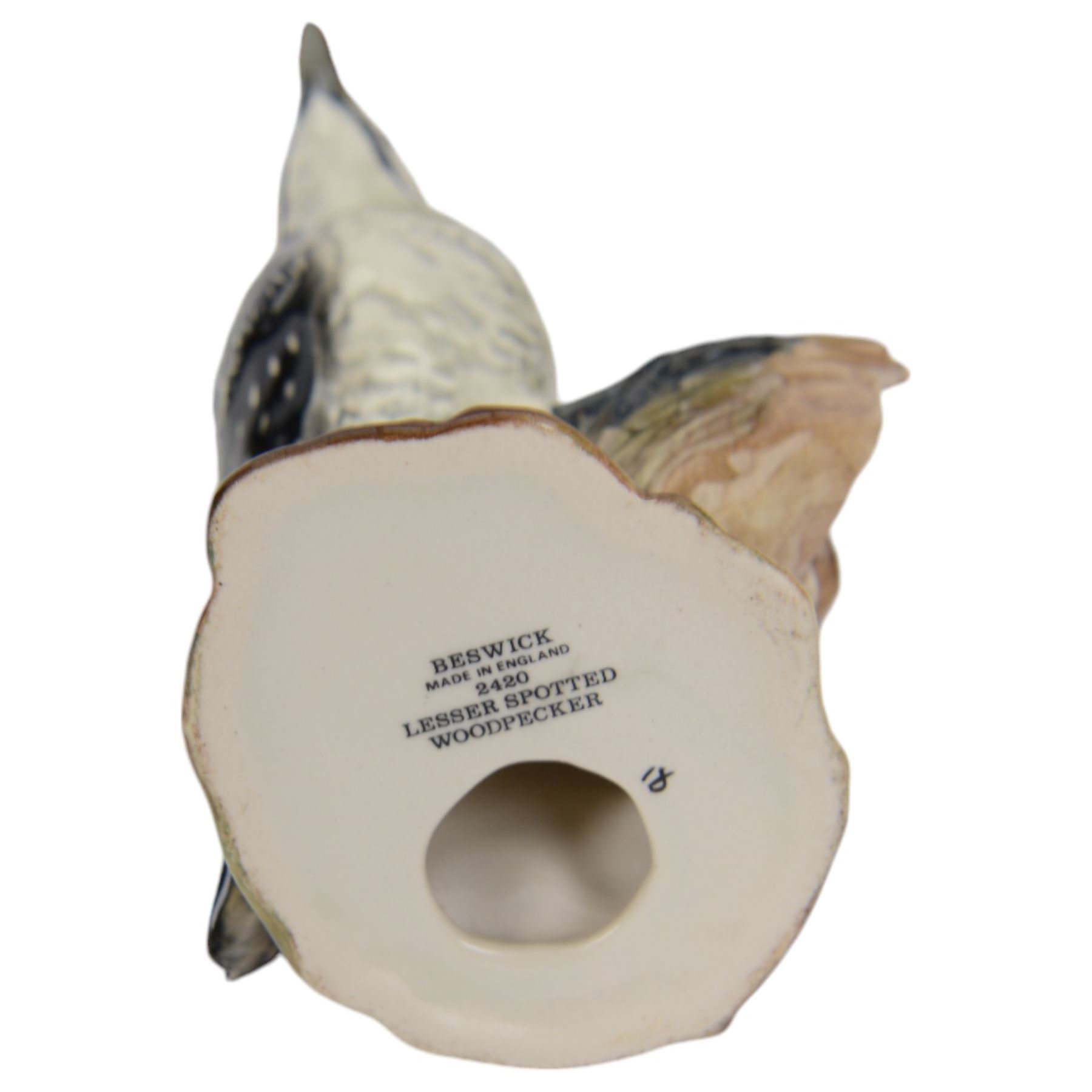 Eleven Beswick bird figures, including Lesser Spotted Woodpecker 2420, Kestrel 316, Lapwing 2416 etc   