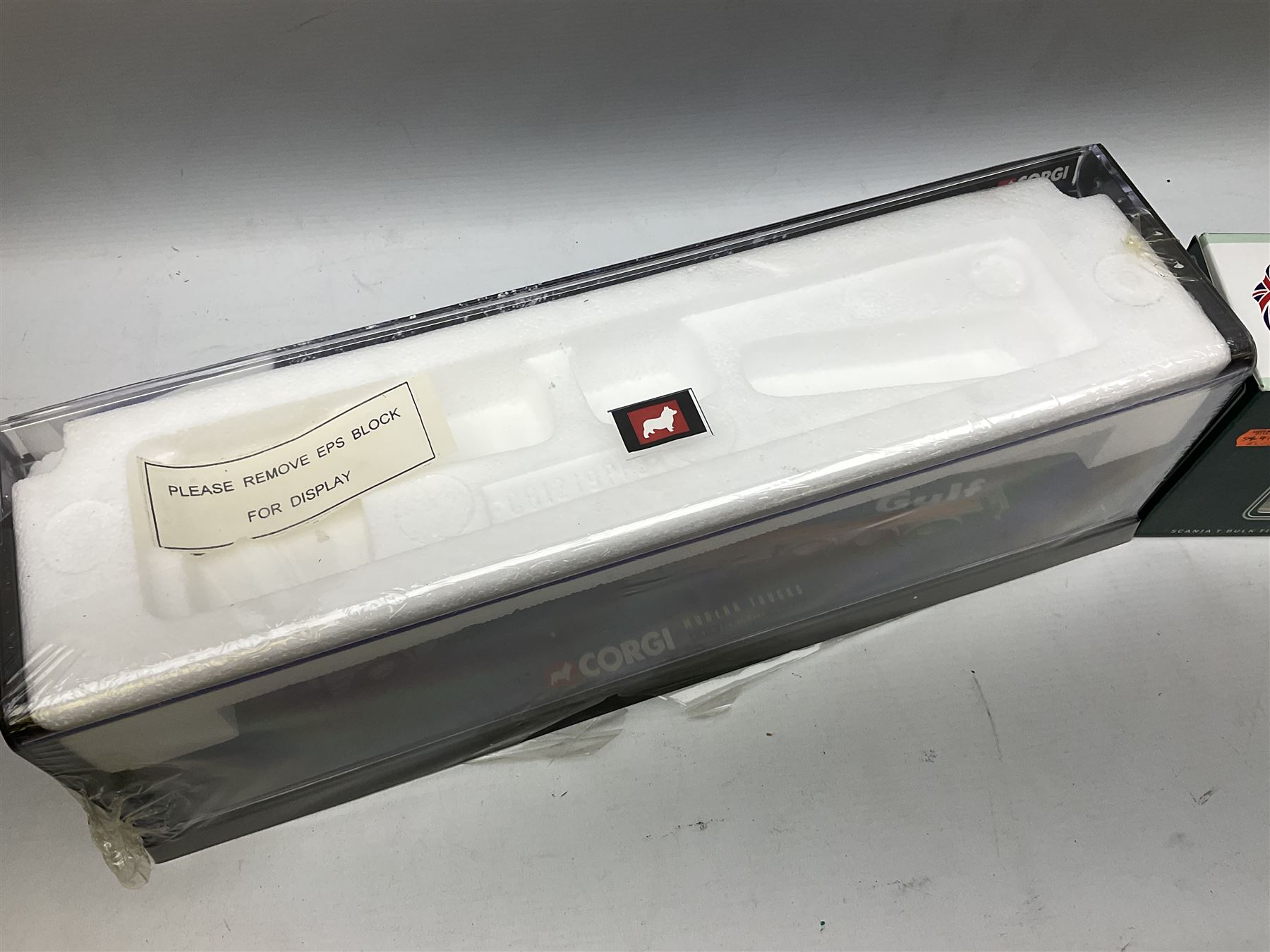 Three Corgi 1:50 scale lorries - ERF Tanker - Gulf Oil in perspex display case No.75101; limited edition Scania T Bulk Tipper - Maguires of Cheltenham No.CC12803; and Scania Topline Curtainside - Stephen Sanderson Limited No.CC12912; all boxed (3)