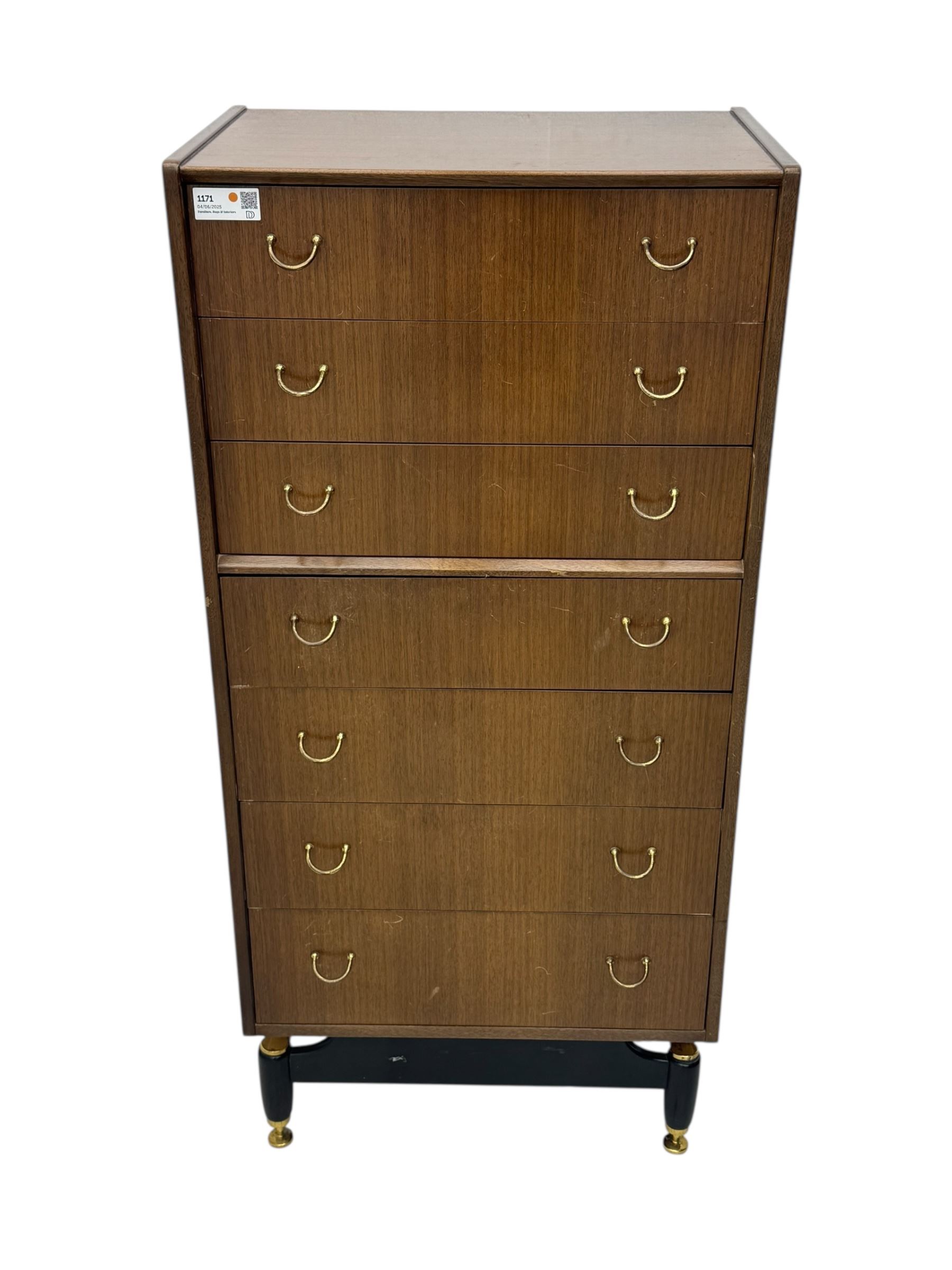 G-Plan teak tallboy, seven drawer chest with brass loop handles, ebonise base with adjustable brass terminals