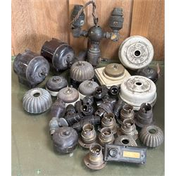 Quantity of reclaimed electrical and light fitting parts, to include brass/ceramic/bakerli...