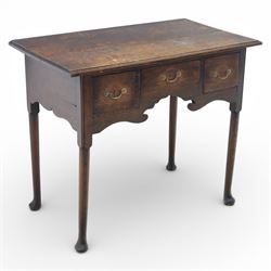 Georgian oak lowboy, the rectangular top with moulded edge over three fitted drawers and s...