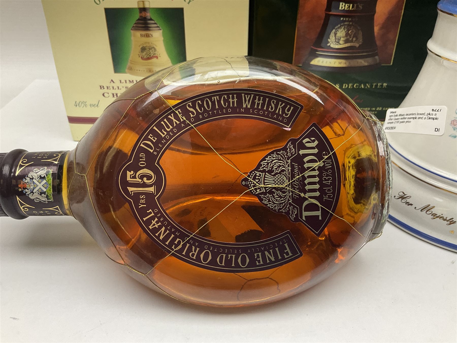 Dimple 15 Year Old Blended Scotch Whisky, together with nine Bells, scotch whisky, in Wade ceramic decanters, including Christmas 1991, 1998, 1996 etc, of various contents and proof 