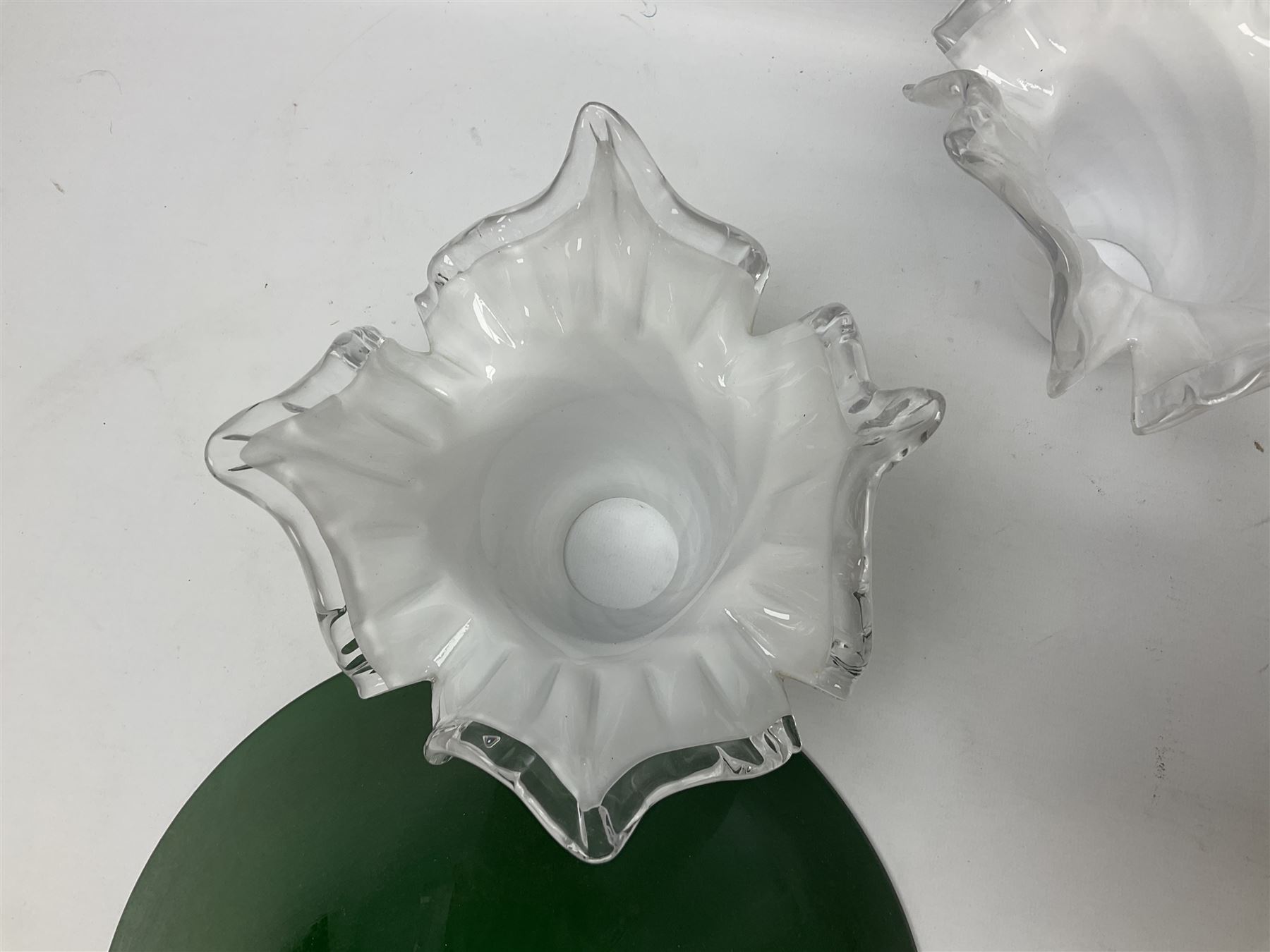 Milk glass lampshade decorated with peacocks, together with a Tiffany style lampshade, a set of five white frilled lamps shades etc 