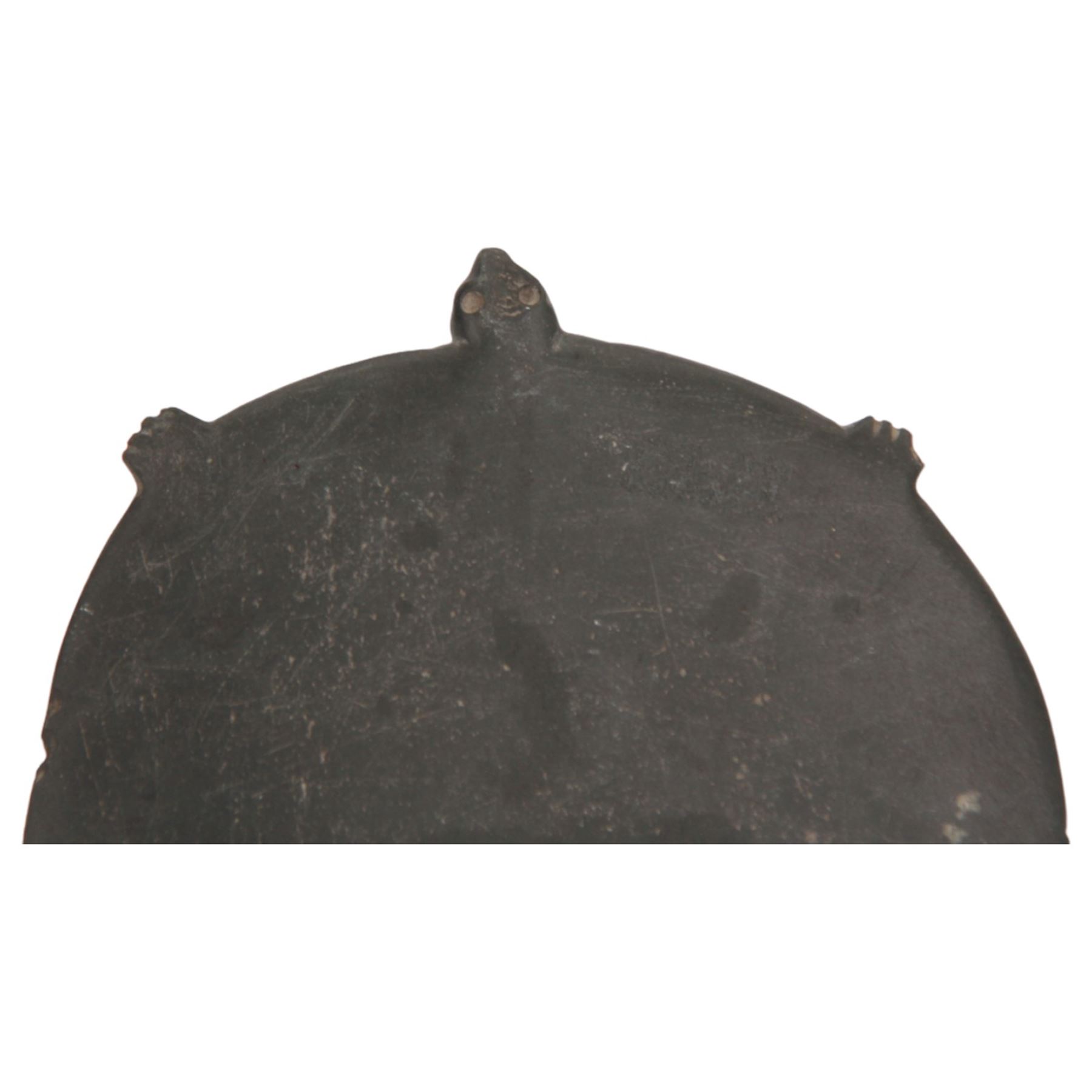 Egyptian greywacke or schist cosmetic palette, circa 3500-3200 B.C., carved in the form of a turtle, with incised eyes, and four small protruding feet, pierced for suspension, L16cm

