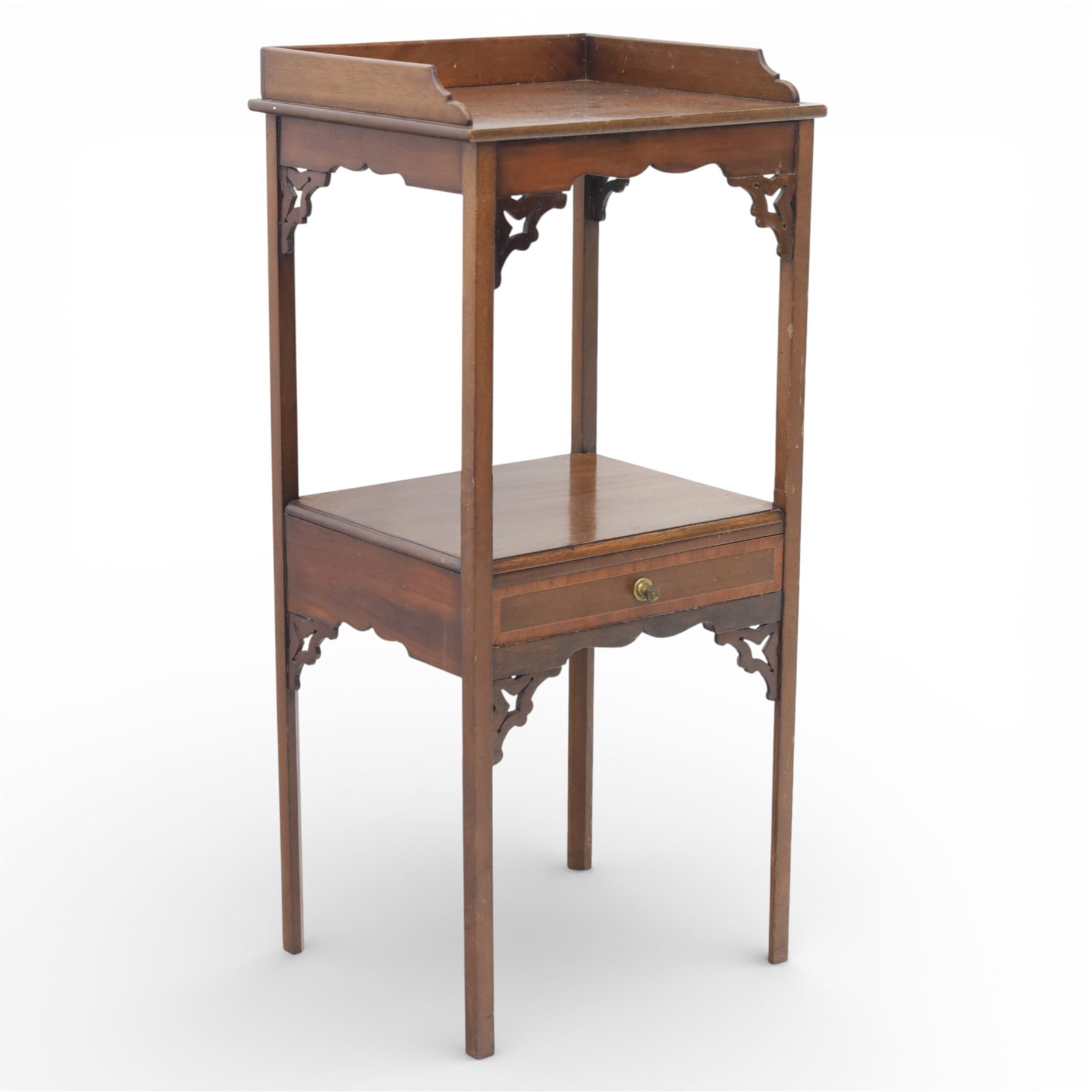 George III mahogany two tier night stand, rectangular tray top with three quarter gallery and shaped cut corners, pierced fret brackets to the apron, fitted with a single drawer to the lower tier, raised on slender square section legs
