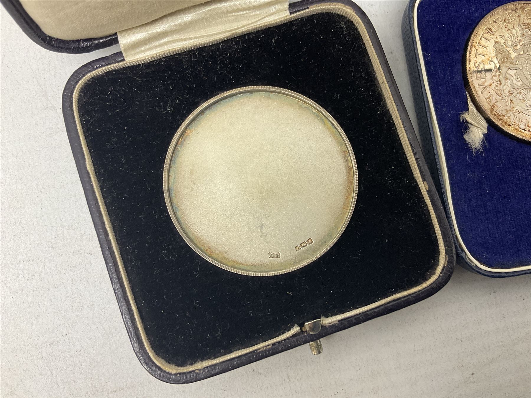 Commemorative coins and medallions, including hallmarked silver poultry medal, Royal Mint 'College of Arms Quincentenary Commemorative Medal', Selby Abbey '1069 1969' medallion, two medallions commemorating the Investiture of H.R.H. Prince Charles 1st July 1969 and a set of four coins commemorating the Investiture of Prince Charles, all cased 