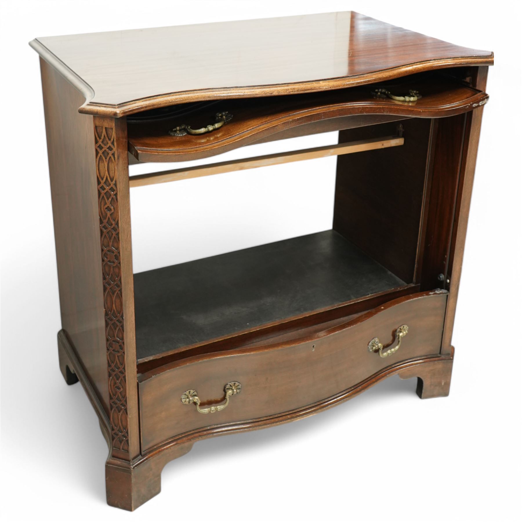 Television cabinet in the form of a Georgian mahogany serpentine chest, flanked by blind fret work decoration, retractable hinged dummy drawer panel revealing interior, with brass swan neck handles, supported on bracket feet 
