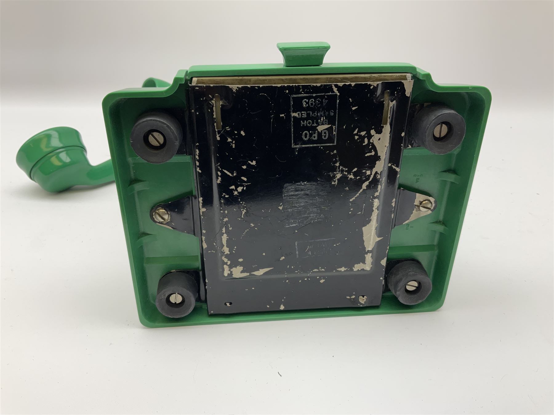 Jade green Bakelite telephone, of pyramid form with rotary alphabet dial, brown braided handset cord and a base draw, W18cm D14cm H15cm