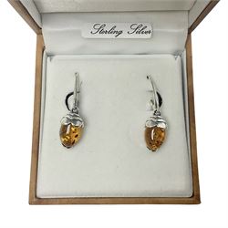 Pair of silver and Baltic amber acorn pendant earrings, stamped 925, boxed 