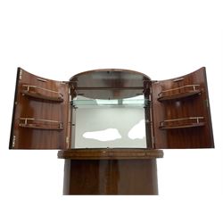 1930s Art Deco walnut demi-lune cocktail cabinet, enclosed by four curved doors, the upper section with mirrored interior, glass shelf and glass holders, the lower section fitted with shelves and bottle holders