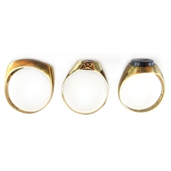  Two 9ct gold gentleman's garnet set rings and an onyx signet ring all hallmarked   