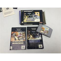 Nintendo 64 console, two controllers, games and accessories. Accessories to include the ‘Tremorpak’ and ‘Spook’ 2 Phono plugs and a S-VHS plug with adapter, both in original boxes. Games to include ‘Golden Eye 007’, ‘Doom 64’, ‘Killer Instinct Gold’, ‘Tetrisphere’, ‘F-1 World Grand Prix’, ‘Pilotwings 64’ and ‘Lylatwars’ with ‘Rumble Pak’, all with original boxes and instruction manuals. ‘Star Wars Episode I Racer’ game cartridge in Shadows of the Empire box. 