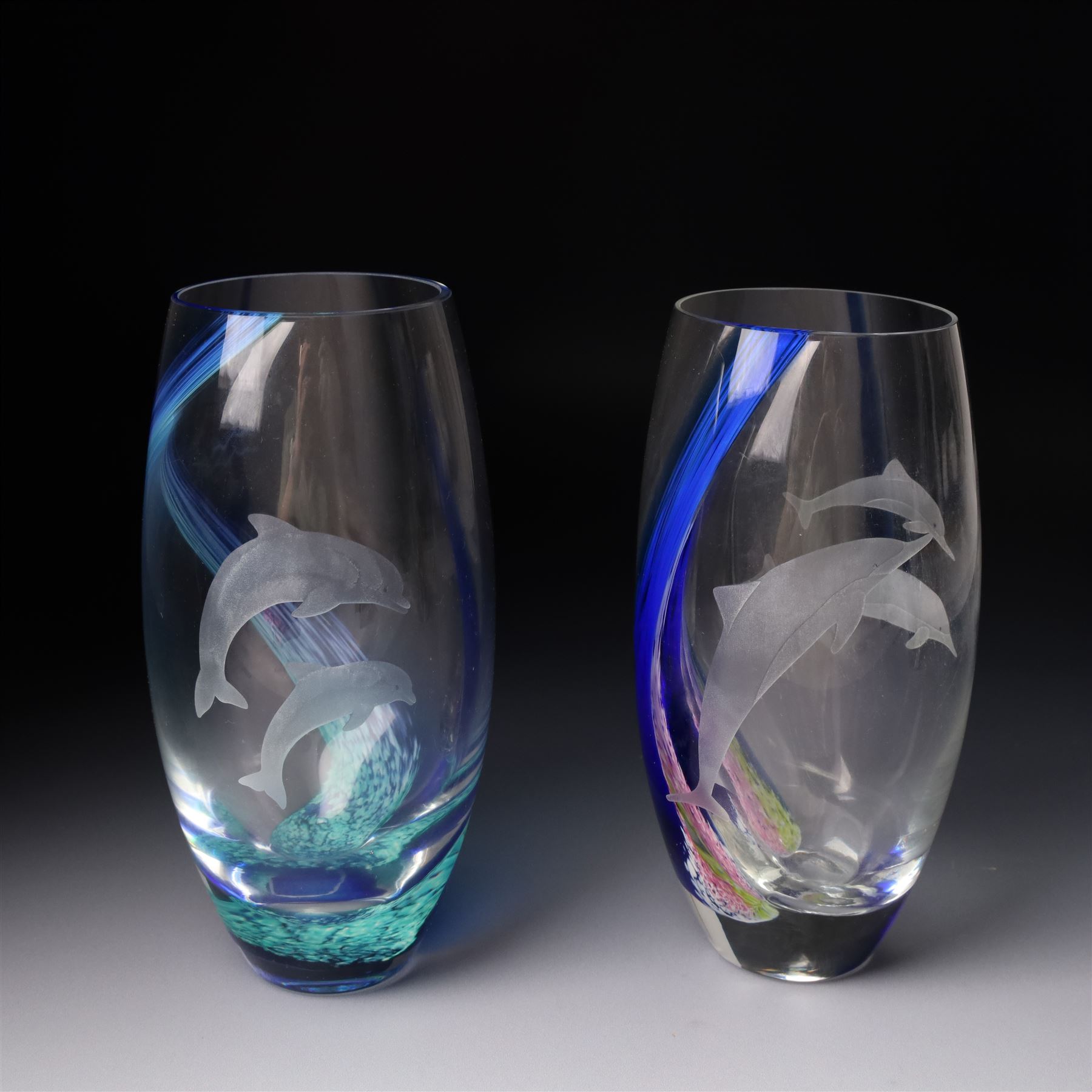 Mats Jonasson Signature Collection glass dolphin, two Caithness glass vases with dolphin decoration, Bohemia glass dolphin, Swarovski dolphin and other dolphin items