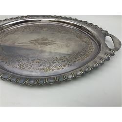 Oval silver plate twin handled tray, egg and dart edge, engraved with floral springs surrounding an central inscription, L65cm