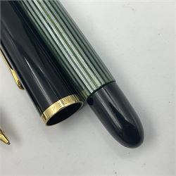 Pelikan Souveran 140 fountain pen, the green and black striped barrel with gold plated beak shaped clip and bands, with gold nib stamped 14C-585, together with matching twist ballpoint pen, push ballpoint pen and propelling pencil, largest approx L13.5cm (4)