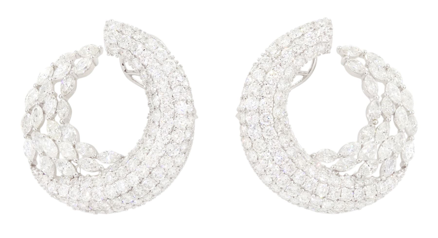 Pair of 18ct white gold marquise cut and pave set, round brilliant cut diamond crescent stud earrings, stamped, total diamond weight approx 9.30 carat