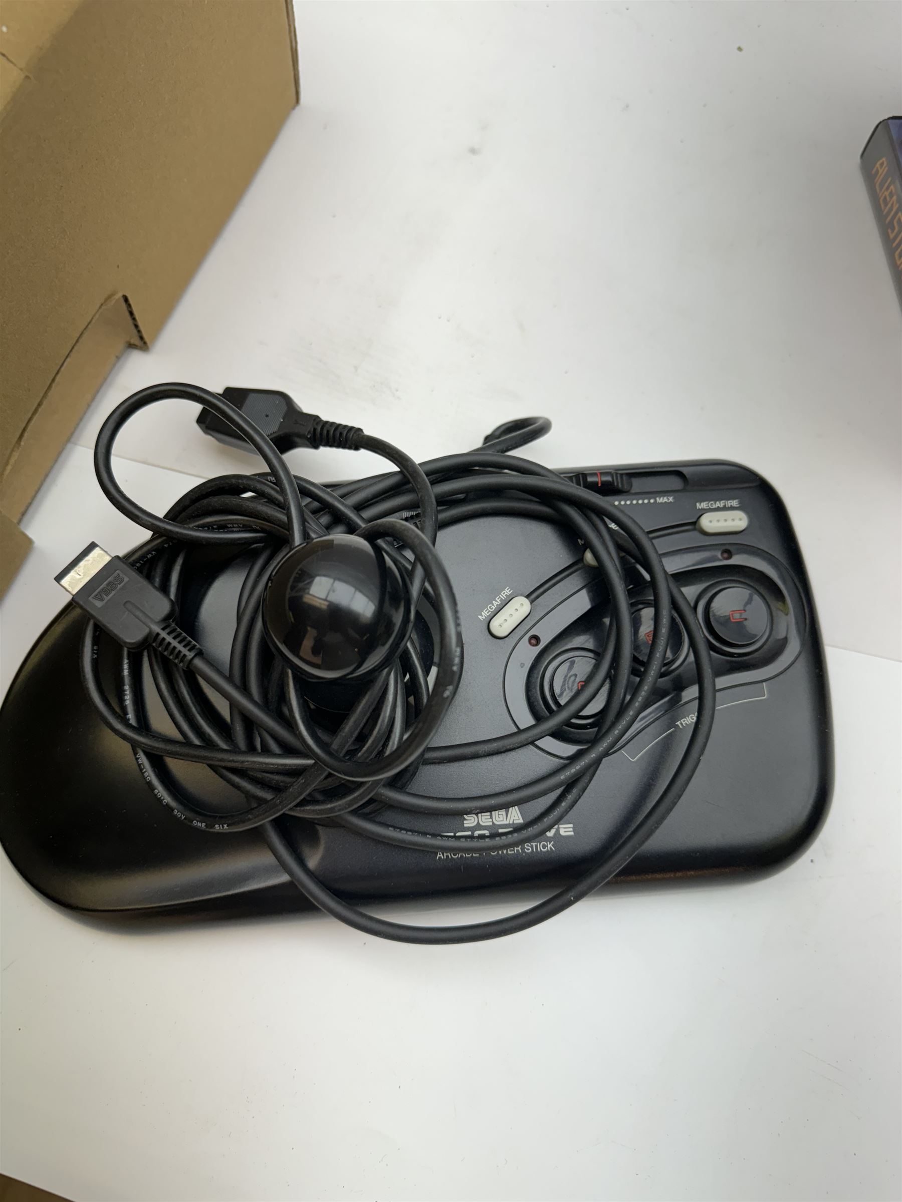 Eighteen Sega Mega Drive games, including Sonic The Hedgehog, Sonic The Hedgehog 2, Alienstorm, Desert Strike, Fatal Rewind, Road Rash etc, all boxed, together with a Sega Mega Drive controller, cartridge converter and an arcade power stick controller