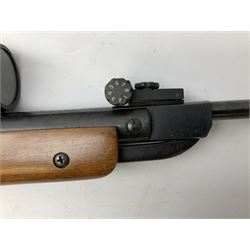 Air Wolf West Germany .22 air rifle with break barrel action, fitted with Nikko Stirling Mountmaster 3-9 x 49 telescopic sight, serial no.E87887 L106cm; in gun sling