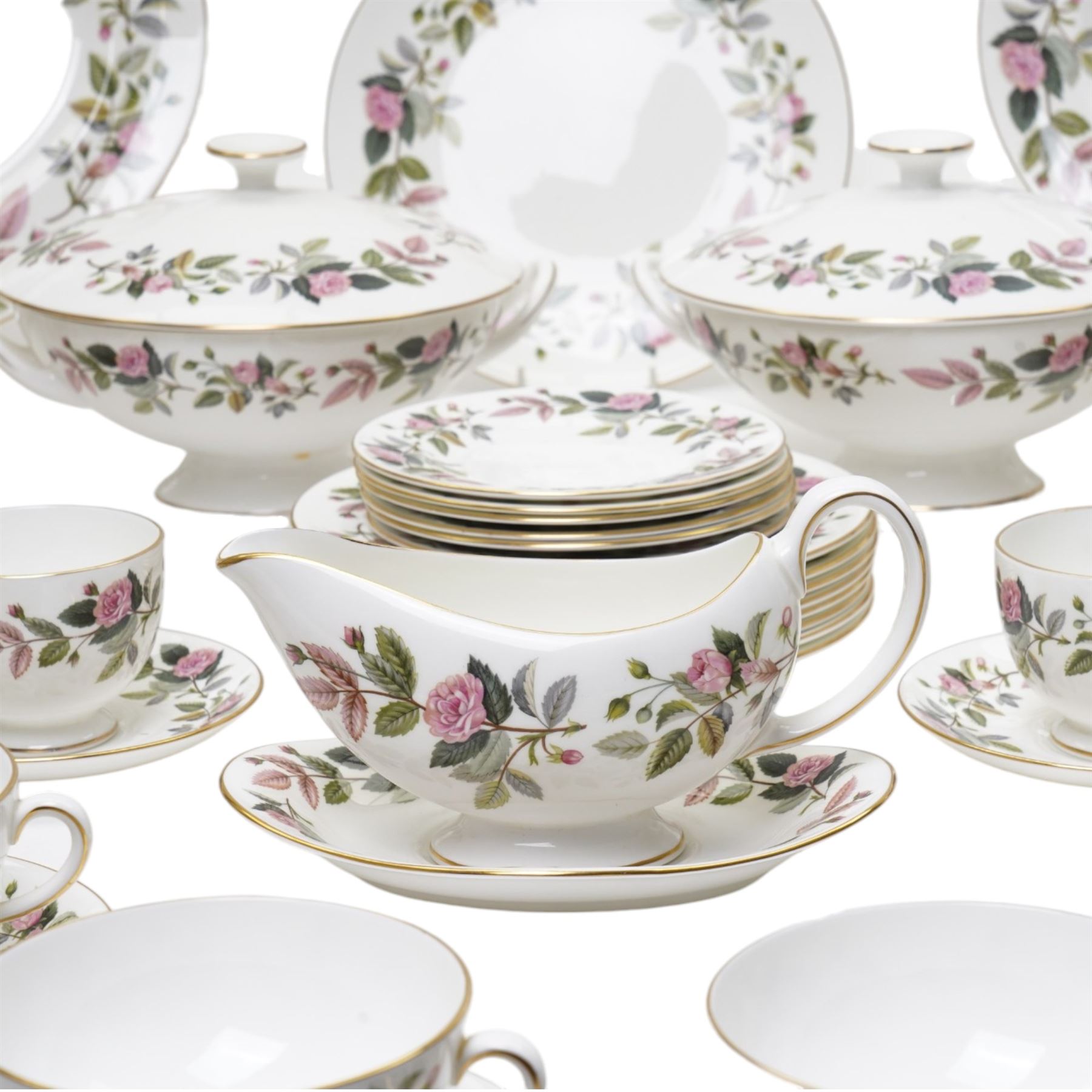 Wedgwood Hathaway Rose pattern tea and dinner wares, comprising two covered tureens, two oval serving dishes, eight dinner plates, eight dessert plates,  six side plates, eight soup bowls and stands, four teacups and saucers, and a sauce boat and stand