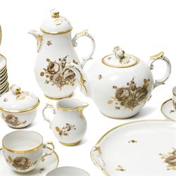 Furstenberg tea service decorated with sprays of flowers within a gilt rim comprising twelve cups and saucers, twelve plates, tea pot, hot water jug, milk jug, sugar bowl and cover and cake plate
