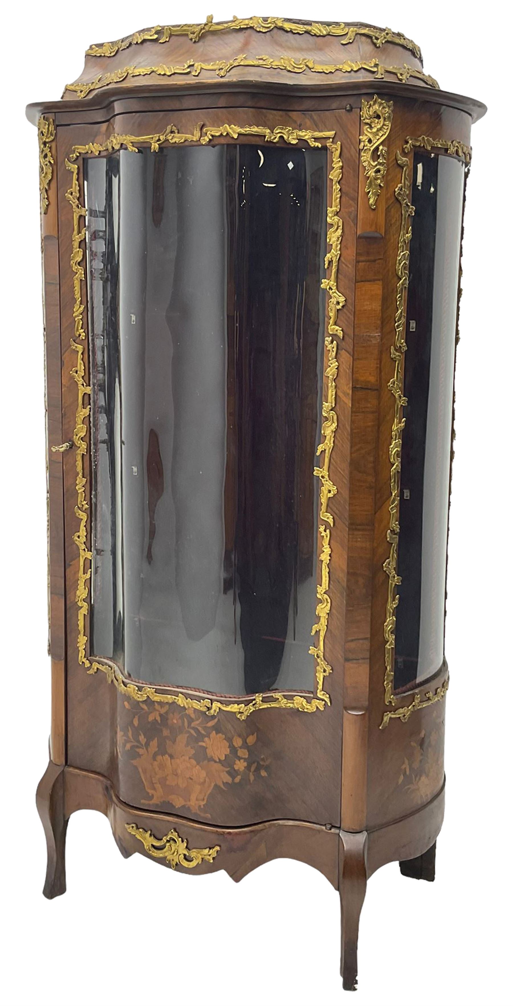 Early 20th century French kingwood vitrine or display cabinet, decorated with applied foliate cast band, serpentine glazed door and sides, inlaid with marquetry decoration of floral bouquets and branches, cartouche mounts to the apron, raised on cabriole supports