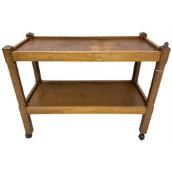 Rabbitman - adzed oak two-tier drinks trolley, raised on square canted supports on castors, carved with rabbit signature, by Peter Heap, Wetwang