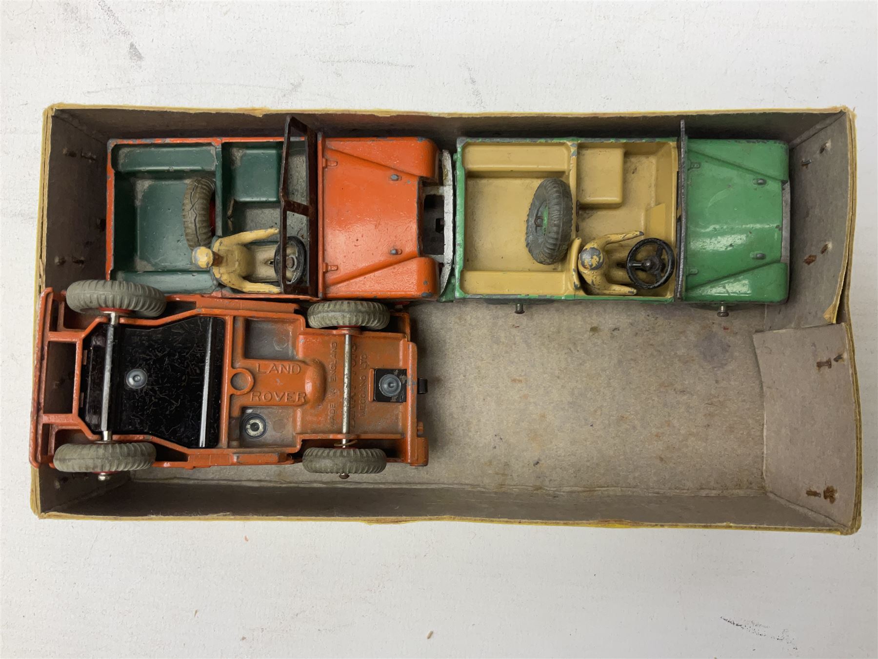 Dinky - trade shop stock box containing four Universal Jeeps No.25Y; and two others containing four Land-Rover Trailers No.27M and three (ex.4) Land-Rovers No.27D (3)
