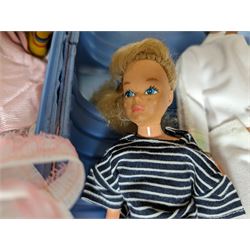 Two Sindy dolls, Barbie doll, Ken doll and one other, together with a collection of dolls clothes 