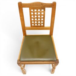 Beaverman - 1980s set of four lattice back dining chairs, shaped top rail above a lattice back, green leather fixed seat, raised on octagonal front supports, with carved Beaver to the back stretcher, by Colin Almack of Sutton near Thirsk