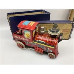Fourteen modern tin-plate toys, predominantly continental/Eastern, including Clown Drummer and battery operated locomotive; both boxed; six buses; battleship; aircraft; elephant juggling ball; police car; etc; together with a tin-plate model of a vintage car (15)