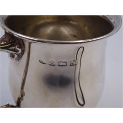 1930s silver Christening mug, of plain waisted form, with acanthus capped scroll handle, upon stepped circular foot, hallmarked Barker Brothers Silver Ltd, Birmingham 1933, including handle H10cm 