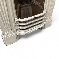 Two Victorian small cast iron fireplaces in a white finish