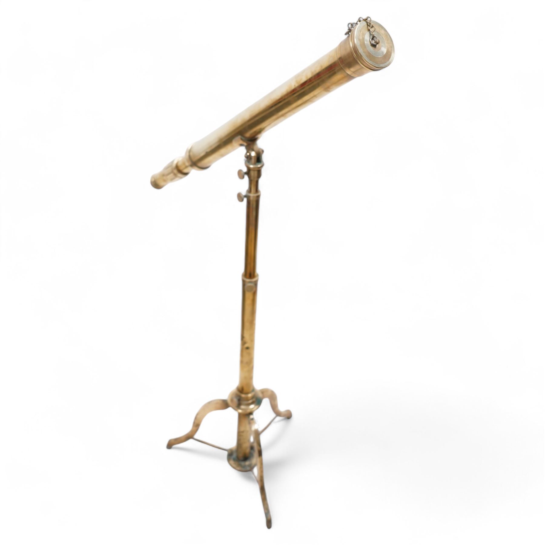 Late 20th-century lacquered brass telescope, the barrel on a telescopic stem, and a tripod stand 