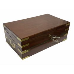 Mahogany brass bounded campaign style writing box, the hinged lid lifting to reveal the green felted folding writing slope and fitted compartmented interior, with glass bottles, inkwells etc, with key