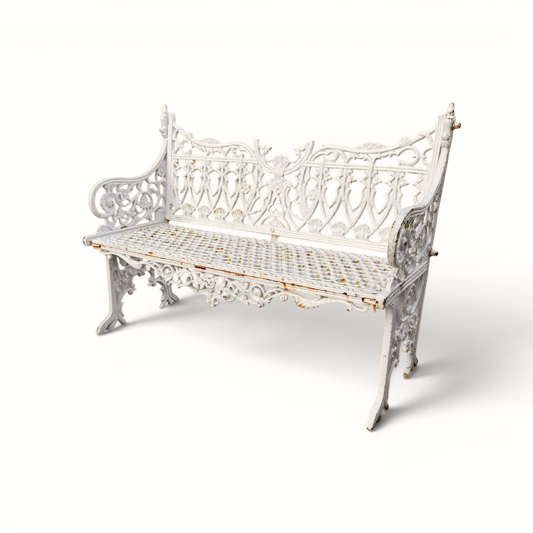 Victorian revival heavy cast iron garden bench, ornate back rest with scrolls, floral motifs and central crest, pierced lattice seat, curved arms and decorative legs, painted in antique white, in the Gothic Coalbrookdale style - Damaged 