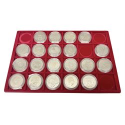 Twenty Queen Elizabeth II Great British five pound coins, housed on a coin tray