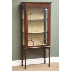  Edwardian mahogany narrow display cabinet, projecting cornice, astragal glazed door enclosing two shelves, square tapering legs, spade feet, W61cm, H140cm, D32cm  