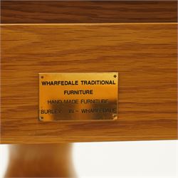 Wharfedale Traditional Furniture - oak dining table and eight ladder back chairs, circular top with stowable leaf forming a large an oval top extending to 167cm, on four splayed legs, together with eight ladder back chairs with green velour drop in seats