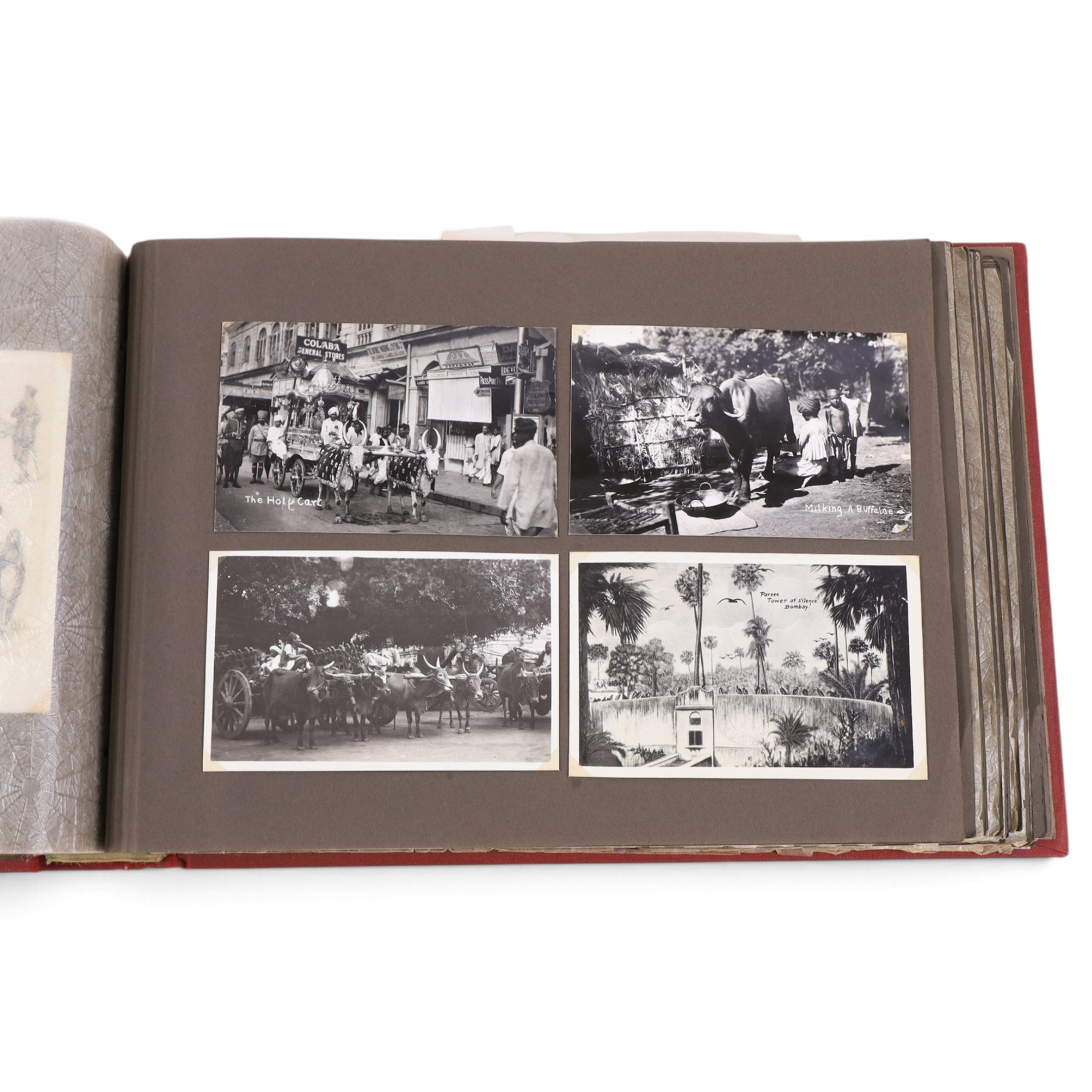 Two early to mid 20th century postcard albums, containing black and white and colour postcards, the first labelled Meine Reisen in Indien containing postcards of Arabia, India, Egypt, some personal photographs and newspaper clippings, of postcards, the second labelled Meine Reisen in England, containing mostly postcards of London, some greetings cards etc
