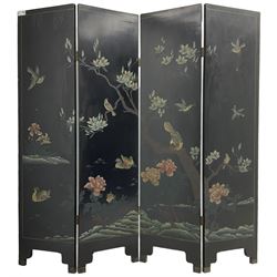 Chinese four-panel folding room screen, black lacquered with a naturalistic scene decorated with trees, birds and flowers