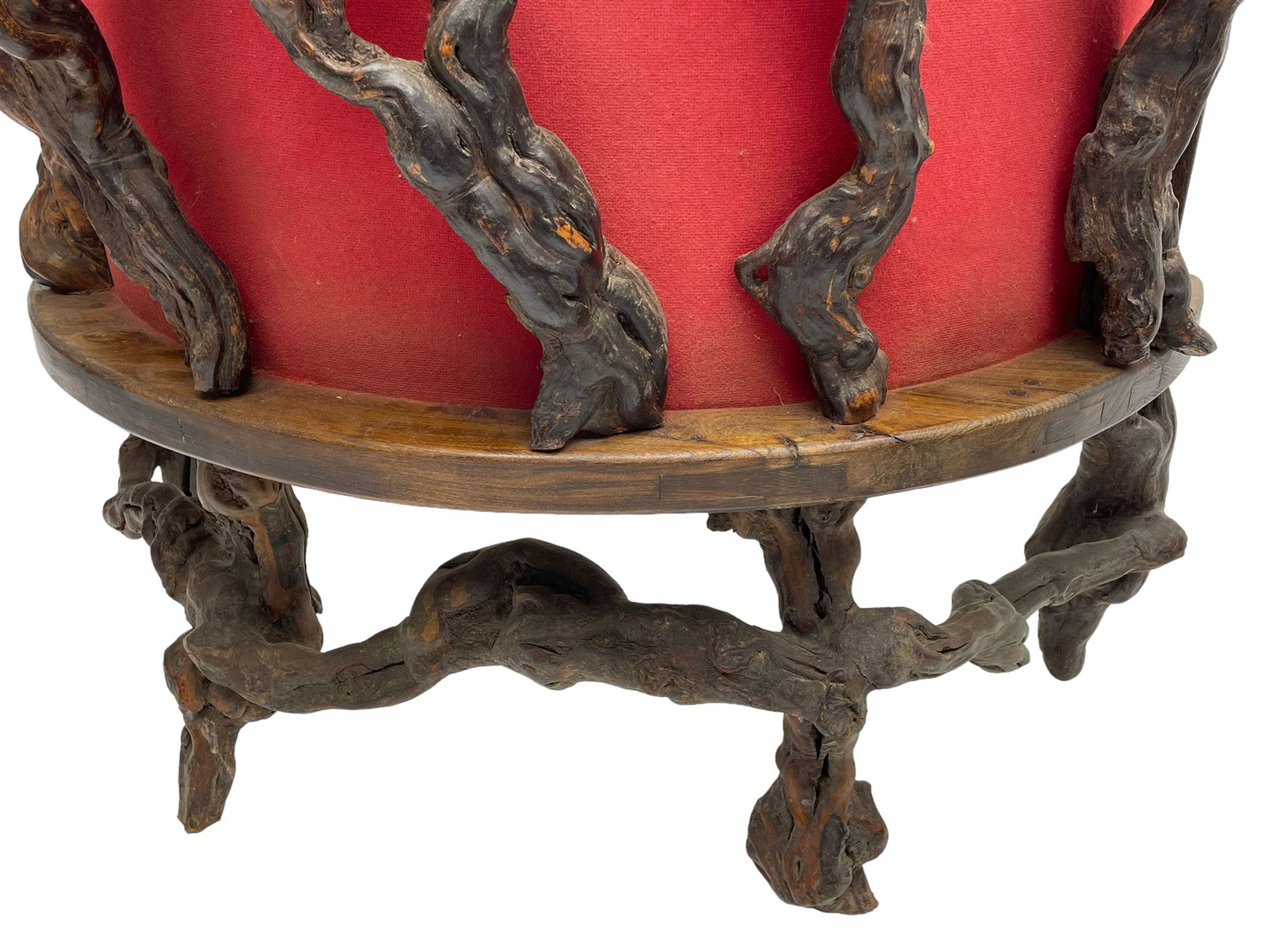 Mid-20th century French grapevine and walnut bow-front wine tasting bar, the curved counter top supported by sculptural grapevine roots, fitted with single shelf and raised on rustic vine feet (W100cm H101cm); with a pair of matching bar stools, the circular top raised on three gnarled root supports united by stretchers (W50cm H70cm)