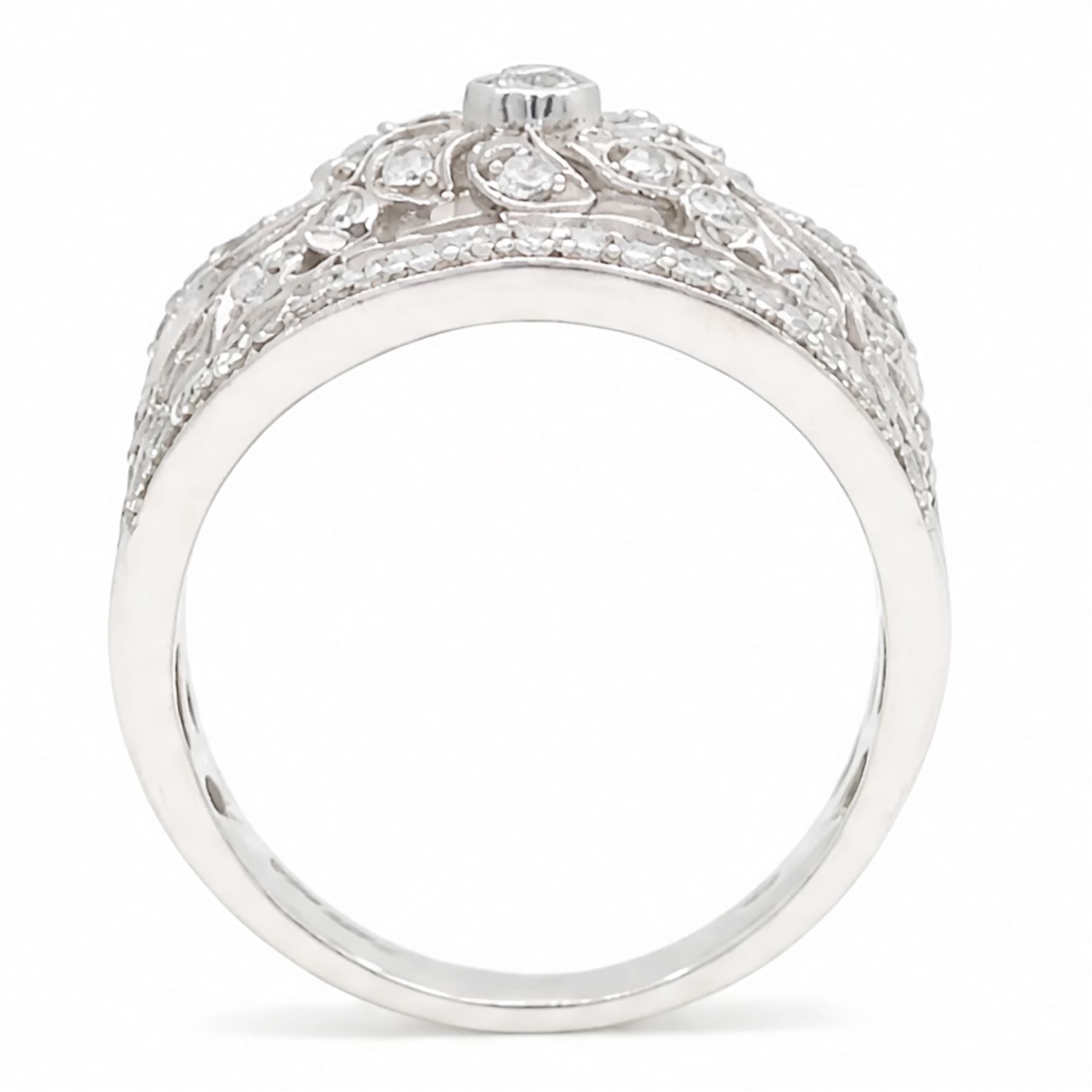 18ct white gold diamond floral ring, milgrain and pierced design set with round brilliant cut diamonds, Edinburgh 2017
