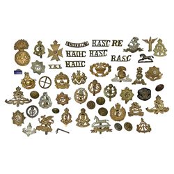  Over thirty WW1 and WW2 cap badges including Royal Marines, RASC, RAOC, Lancashire Fusiliers, York & Lancaster, RE, RA, East Yorkshire, Royal Berkshire, RAC, ATS, RAMC, West Yorkshire, Reconnaissance Corps etc; Services Rendered badge No.B143796; small quantity of shoulder titles, buttons etc