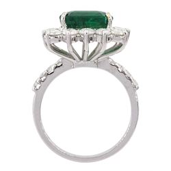 18ct white gold octagonal cut emerald and round brilliant cut diamond cluster ring, with diamond set shoulders, emerald 4.64 carat, total diamond weight 1.80 carat, with World Gemological Institute report
