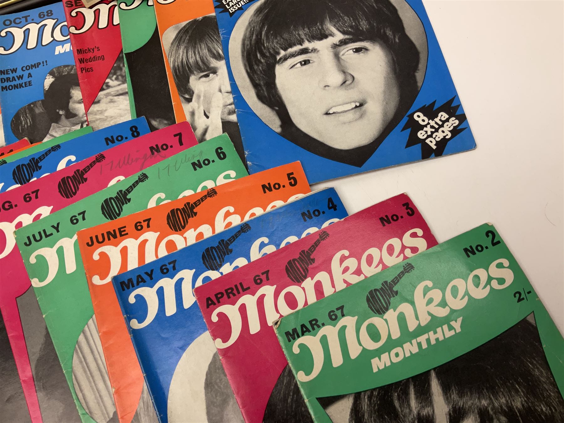 Monkees memorabilia - 'Monkees Monthly' magazine almost complete run from No.1 Feb 67 to No.31 Aug 69 (lacking nos.29 and 32); the cover of No.1 signed by all four members of the group during their 1997 Reunion Tour; quantity of A&BC bubble gum cards; programme for their only UK live performance in 1967 at Empire Pool Wembley; and other related late 1960s music magazines/paperback book