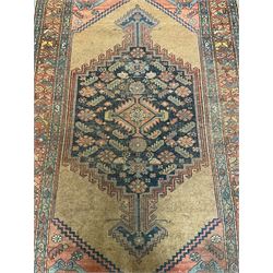 Old Turkish rug, possibly Anatolian, the indigo ground pole medallion decorated with stylised floral motifs, enclosed by spandrels with stylised flower heads, repeating border with guard stripes 