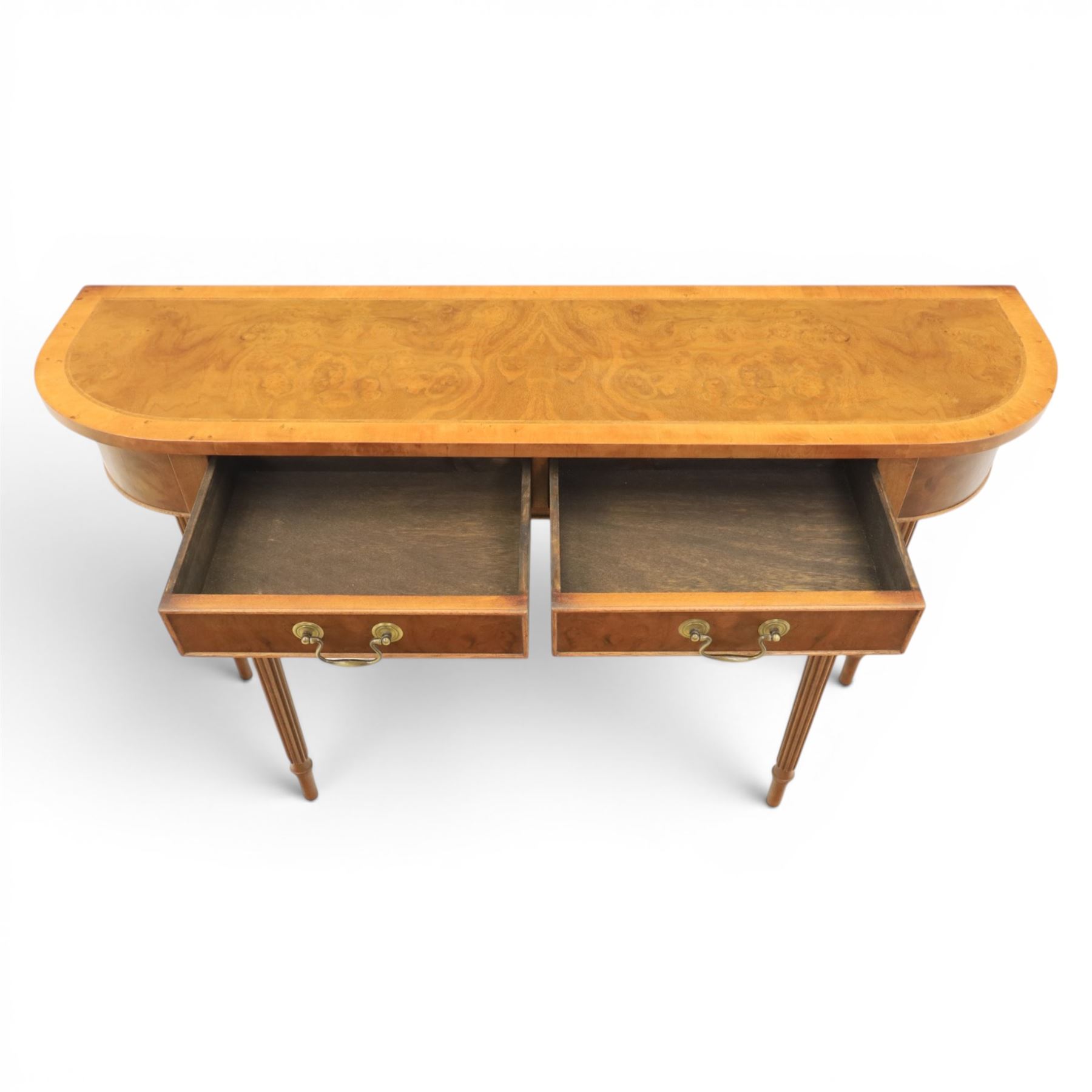 Traditional design walnut D-end hall table, figured top and sides, two frieze drawers with brass handles raised on fluted and turned supports