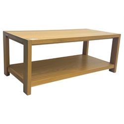 Light oak rectangular coffee table, with exposed finger joints to the corners, raised above a full-length undertier on straight supports