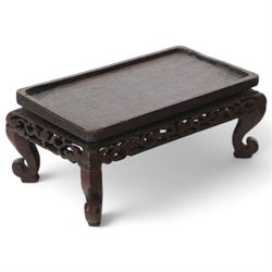 Chinese carved hardwood model of an ox or water buffalo, with attendant upon back, upon a carved openwork stand with cabriole lets, model H6.5cm L13cm