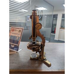 19th century brass binocular microscope by R&J Beck, 31 Cornhill London, numbered 6386, with rack and pinion focusing, housed in wooden case with case of accessories, including eyepieces, objective lenses and condenser